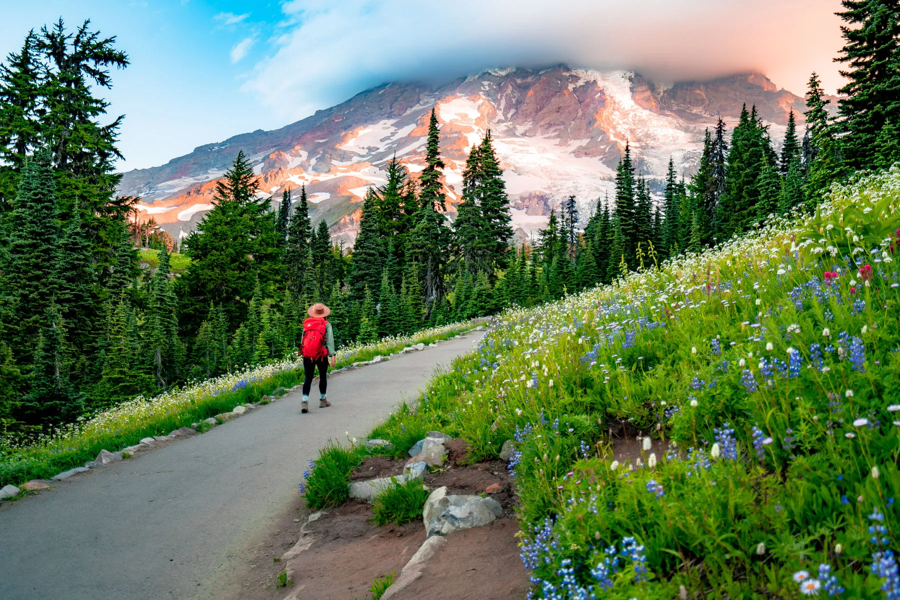 A Day Hiking At Mount Rainier National Park This trail is moderately challenging and offers spectacular views of the mountain, as well as opportunities to see meadows filled with wildflowers and even a waterfall along the way.