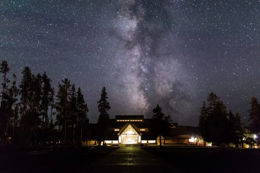 Milky Way and Aurora Experience at Yellowstone National Park Milky Way over the Old Faithful Visitor Education Center